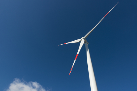 Wind turbines generate electricity with blue skyの写真素材