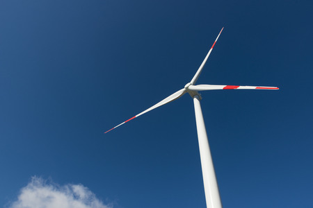 Wind turbines generate electricity with blue skyの写真素材