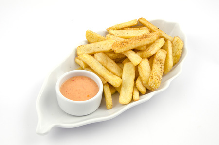 potato fries and sauce on the plate on the white backgroundの写真素材