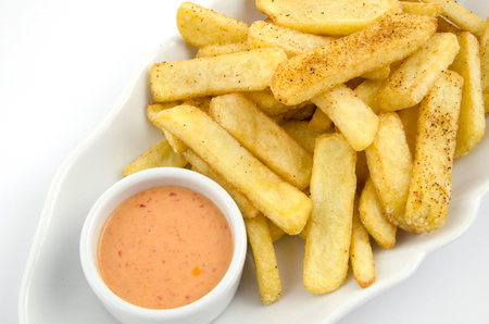 potato fries and sauce on the plate on the white backgroundの写真素材