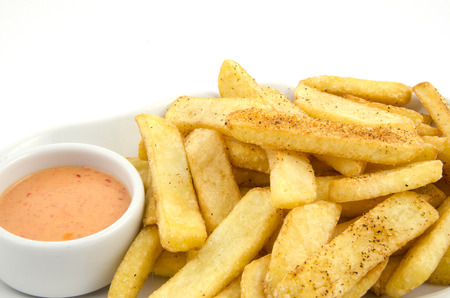 potato fries and sauce on the plate on the white backgroundの写真素材