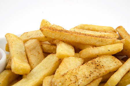 potato fries and sauce on the plate on the white backgroundの写真素材