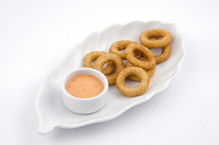 onion ring in white plateの写真素材