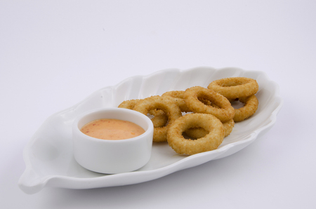 onion ring in white plateの写真素材