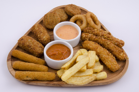 mixed snack fries on wood boardの写真素材
