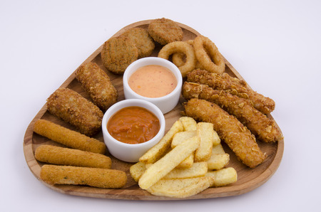 mixed snack fries on wood boardの写真素材