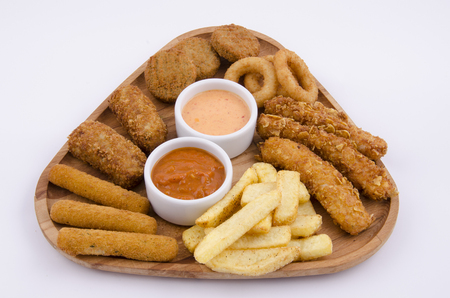 mixed snack fries on wood boardの写真素材
