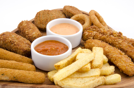 mixed snack fries on wood boardの写真素材