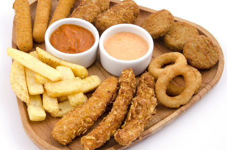 mixed snack fries on wood boardの写真素材
