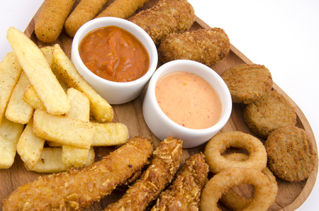 mixed snack fries on wood boardの写真素材