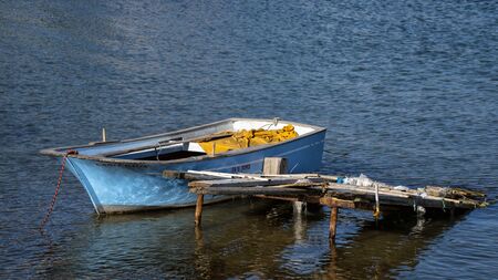 small fishing vessel tied up at the dockの写真素材