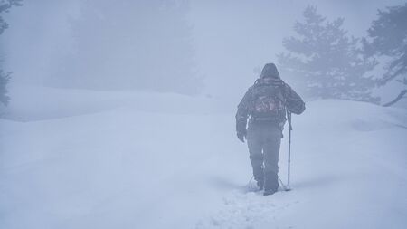 escalating up the mountain the air foggy in the winter campの写真素材