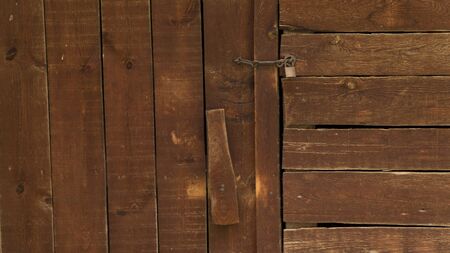 old wooden door with rusty locksの写真素材