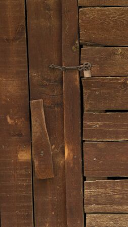 old wooden door with rusty locksの写真素材