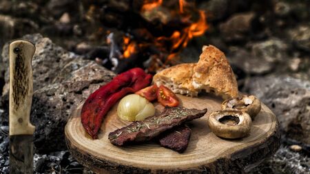 grilled meat on camping food on wooden serviceの写真素材