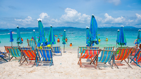 Colorful sunshade and chairs on beach in Phuketのeditorial素材