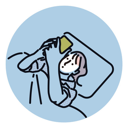 A woman touching her smartphone before going to bedのイラスト素材