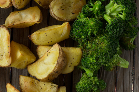Shot of potatoes and broccoli on grill top viewの写真素材