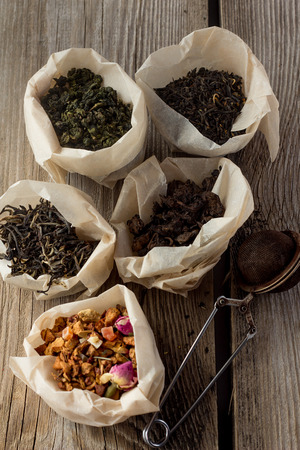 White, black, fruit tea, milk oolong, puer in paper bagsの写真素材