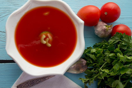 Shot of tomato gazpacho in white dish top viewの写真素材