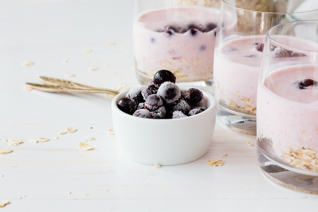 Frozen berries and glasses with yoghurt selective focusの写真素材