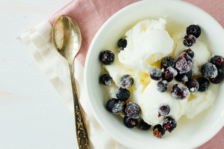 Ice-cream with frozen berries top view selective focusの写真素材
