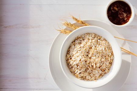 Bowl with oatmeal and honey top view selective focusの写真素材