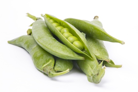 Pea pods and peas in white backgroundの写真素材
