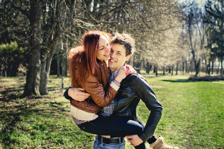 an image of couple in love walking through the parkの写真素材