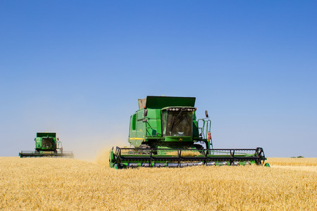 Khmelnitskiy, Ukraine - July 23: Modern John Deere combine harvesting grain in the field near the town Khmelnitskiy, Western Ukraine July 23, 2015のeditorial素材
