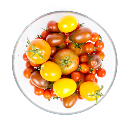 an image of a fresh tomatoes on plateの写真素材