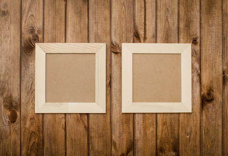 an image of photo frames on wooden backgroundの写真素材
