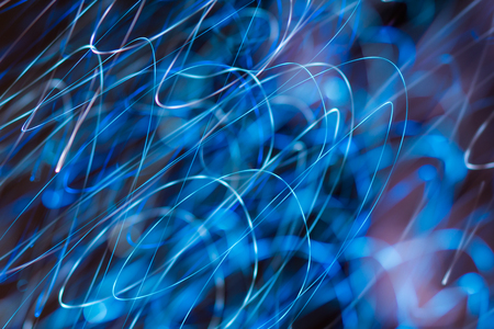 an image of bright sparks on colorful background with bokeh effectの写真素材