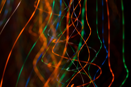 an image of bright sparks on colorful background with bokeh effect