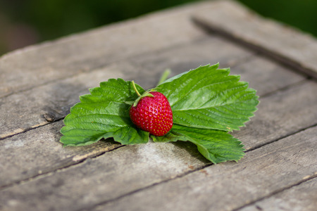 an image of fresh strawberries on wooden table