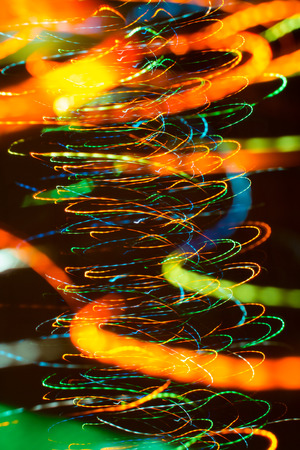 an image of bright sparks on colorful background with bokeh effectの写真素材