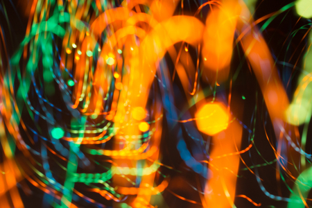 an image of bright sparks on colorful background with bokeh effectの写真素材