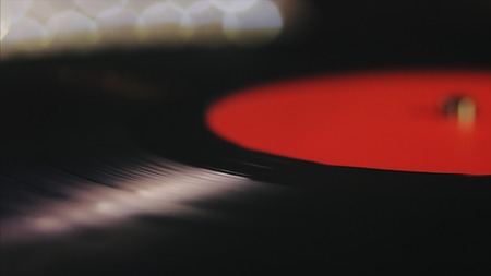 A retro-styled spinning record vinyl player.の写真素材