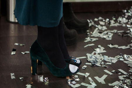 Womans legs in high heels at the party.の写真素材
