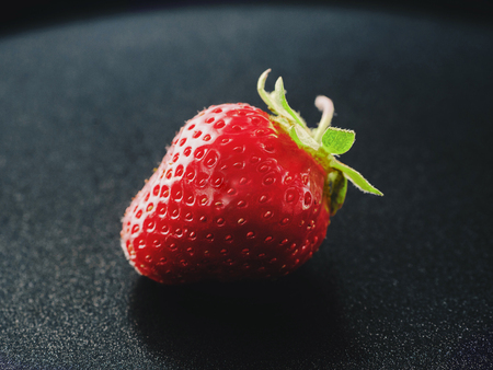 Fresh Strawberry toned image. Fresh, ripe, juicy on grey backgroundの写真素材