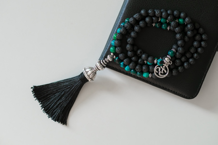 Beautiful handmade lava mala gems beads with tassel for mantras and meditationの写真素材