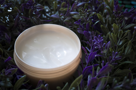 Natural hand cream in lavender flowers. Close-up cosmetics product.の写真素材