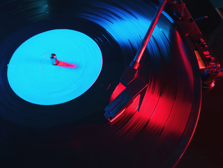 Cinemagraph, retro record vinyl player. Record on turntable. Top view close up. Loop-able Vintage photo of Old Gramophone, playing a musicの写真素材