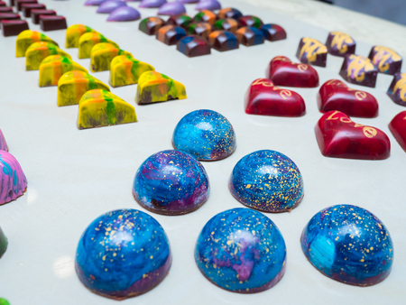 Assortment of luxury handmade chocolate candy collection isolated on white background. Set of colorful chocolate bonbons.の写真素材
