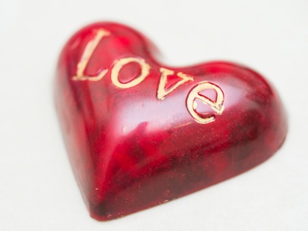 chocolate handmade red heart shaped candy with word loveの写真素材