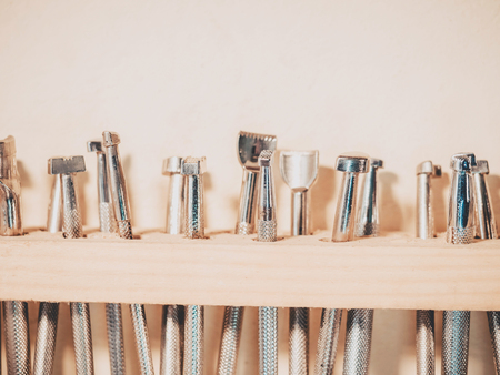 Carving stamps set tool on the shelf. Leather craft instruments for processing of natural materialsの写真素材