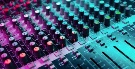 Close up of sound mixing console. Details of sound engineer room. Neon light