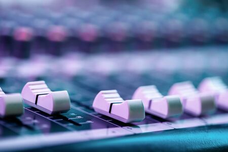 Close up of faders on sound mixing console. Details of sound engineer room.