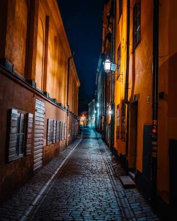 Beautiful cozy night narrow street in Gamla Stan - old town of Stockholm. 14 February 2020, Stockholm Swedenのeditorial素材