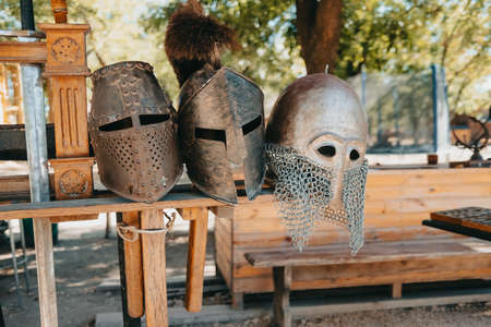 Exhibition of Medieval knightly armor in ancient fortress. Swords, shields and other weapons.の写真素材